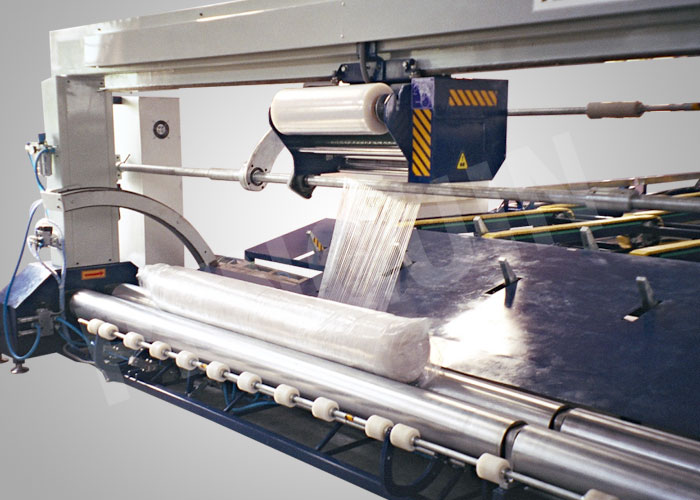 fabric roll wrapping machine for larger width rolls